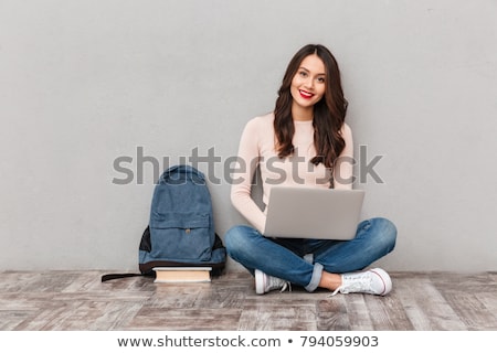 Foto stock: Image Of Happy Girl 20s Smiling And Holding Silver Laptop Isola