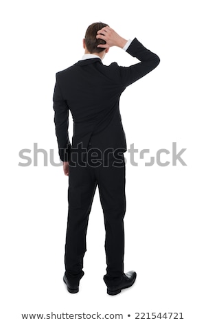 Stock fotó: Back View Of A Confused Business Man Scratching His Head