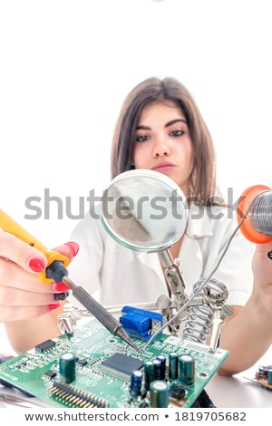 Stok fotoğraf: Female Technician Using Soldering Iron