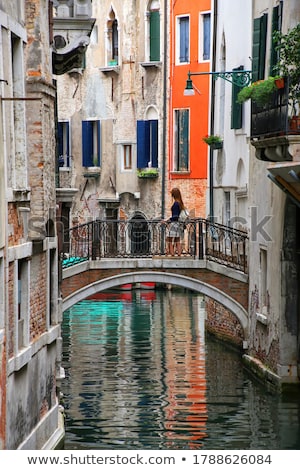 Stock photo: Bridge Connecting The Houses Along The Canal