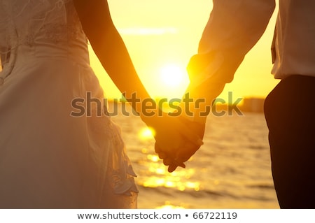 Zdjęcia stock: Hands In Love Couple Holding Hands On The Sea Shore