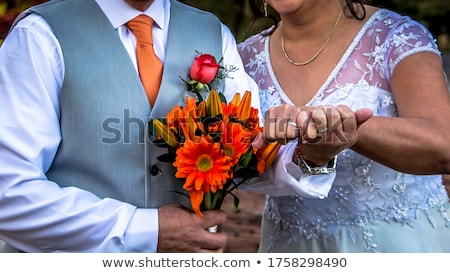 Stok fotoğraf: Happy Elegant Couple Holding Hands