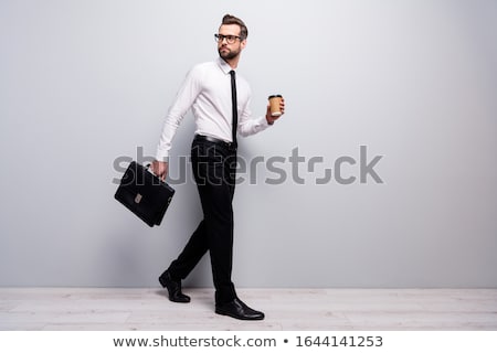 Foto stock: Young Employee With Briefcase Isolated On White