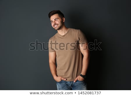 Stock photo: Portrait Of Young Bearded Hipster Guy On Gray Dark Background Close Up Brutal Modern Man Lifestyle