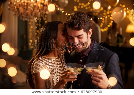 Foto stock: Couple Kissing At A Cocktail Party