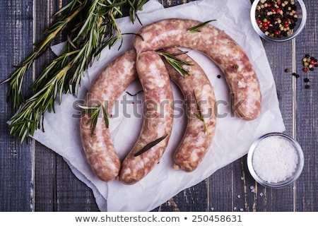 Stock fotó: Butcher Packing Raw Sausages