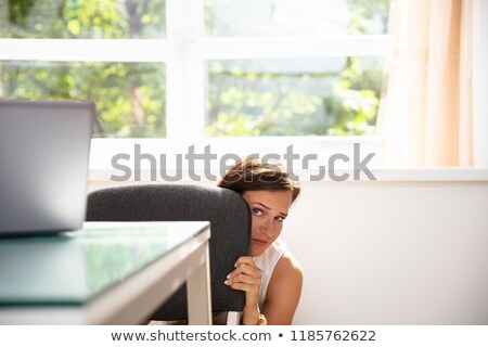 [[stock_photo]]: Businesswoman Hiding Under Desk