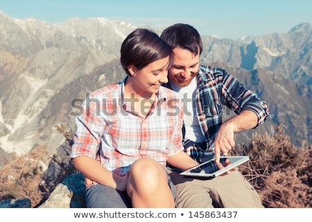 Zdjęcia stock: Happy Couple With Backpacks And Tablet Pc Outdoors