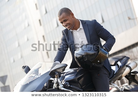 Сток-фото: Excited Young Businessman Riding On A Motorbike