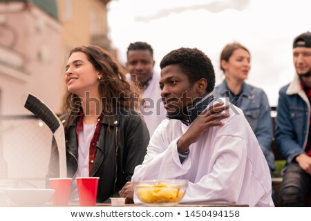 [[stock_photo]]: Young Intercultural Hockey Fans Watching Match Broadcast