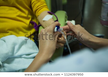 Stok fotoğraf: Woman Being Treated By Doctor