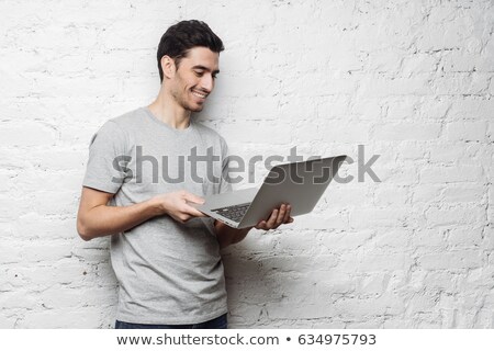 [[stock_photo]]: Boy Working With A Notebook Against A White Background