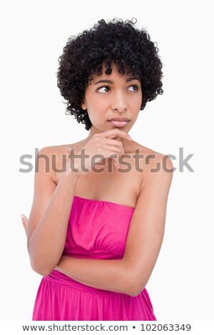 Zdjęcia stock: Teenager Looking To The Side While Thoughtfully Putting Her Hand On Her Chin