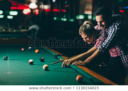 Foto stock: Couple Playing Billiards