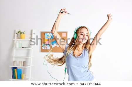 Stock foto: Teen Girl Dancing On The Tune