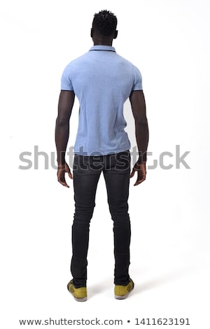 Foto d'archivio: Rear View Of A Casual Young Man Standing