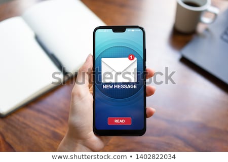 Stockfoto: Woman Checking Mail Inbox On Cellphone