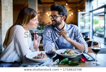 Foto d'archivio: Good Food And Tasty Red Wine In A Restaurant