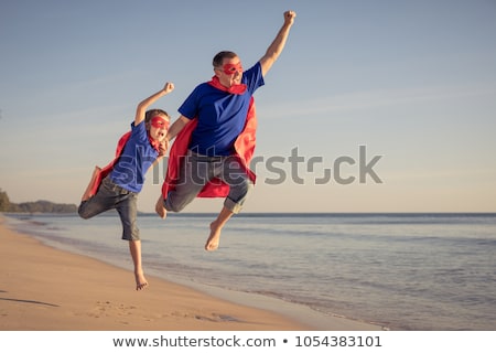 ストックフォト: Father And Son Playing Superhero At The Day Time