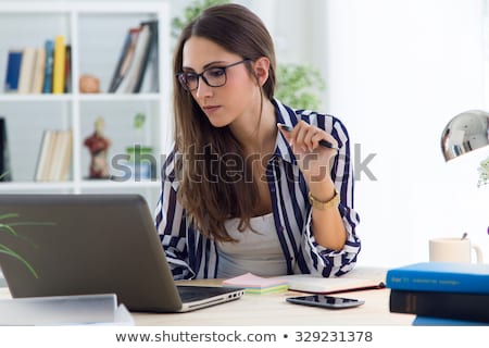 Stock photo: Portrait Of A Beautiful Young Woman Working