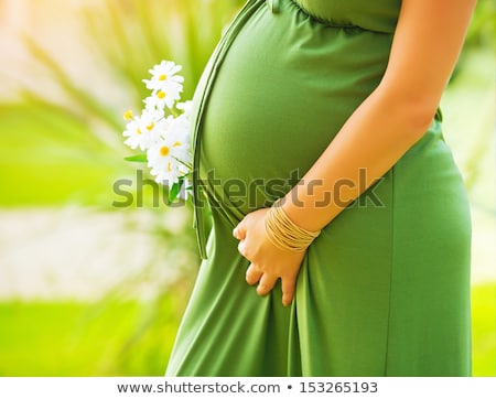 Foto stock: Pregnant Woman With Flower