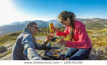 Stock fotó: Sausages On One Time Use Grill