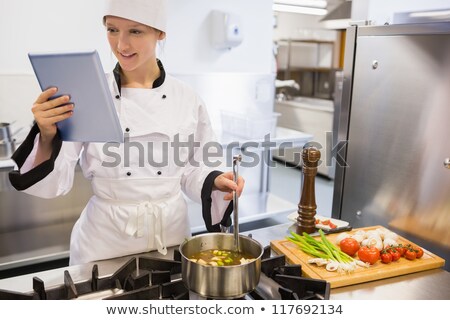 Stockfoto: Happy Chef Using Pepper Mill