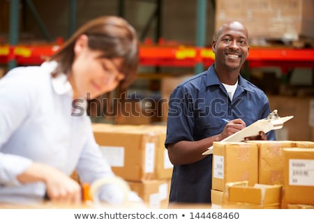 Stock photo: Worker Preparing Goods For Dispatch