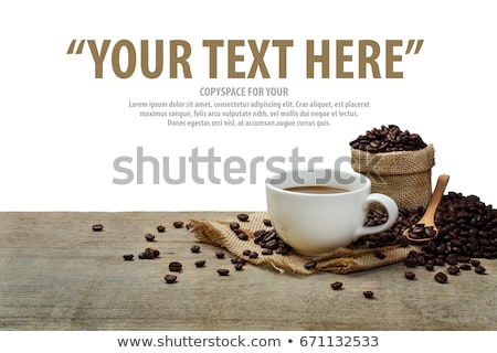 Zdjęcia stock: Hot Coffee In Black Cup With Crema And Beans With Copy Space On Brown Old Wooden Board Background T