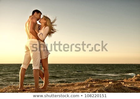 Stock fotó: Couple Embrace In Twilight