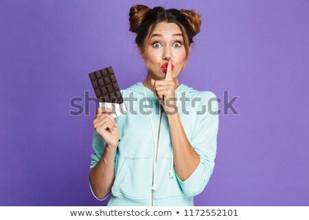 Foto stock: Portrait Of Smiling Woman Showing Silence Gesture Isolated