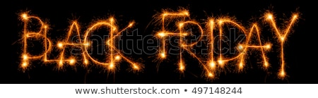 Stockfoto: Sparkling Inscription Of Black Friday On A Black