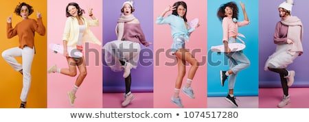 Foto stock: Full Length Portrait Of A Carefree Young Woman