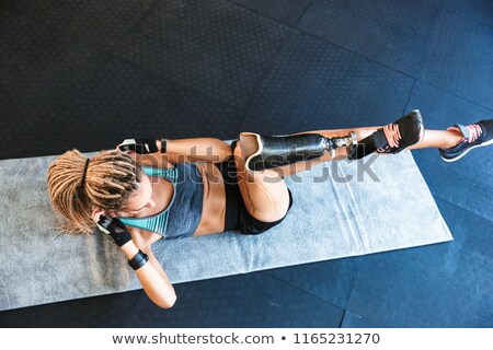 Stockfoto: Portrait Of Fitness Disabled Woman In Tracksuit Doing Crossfit E