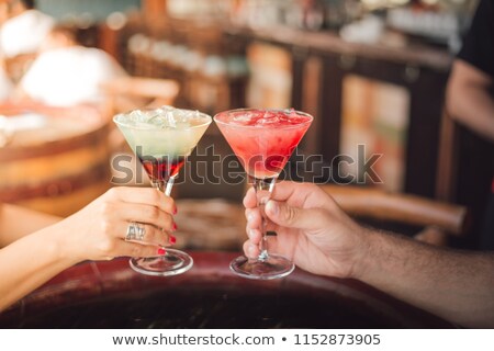 Foto stock: Couple Toasting Coconut Water