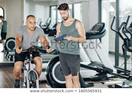 Foto stock: Exercising With Trainer