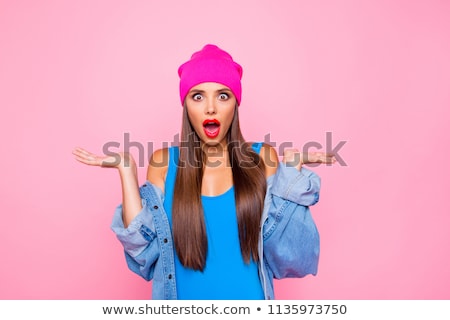 Foto stock: Beautiful Amazed Young Woman With Shocked Unexpected Expression Indicates With Fore Finger At Her N