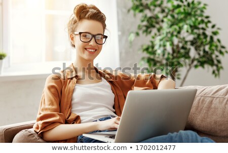 Сток-фото: Optimistic Young Girl Using Laptop Computer