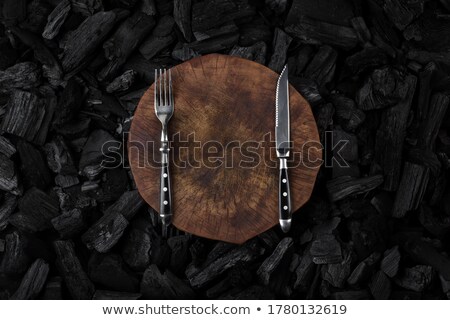 Foto stock: Knife On A Wood Board