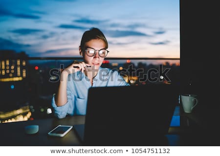 Foto stock: Female Freelancer Working Overtime In Home Office