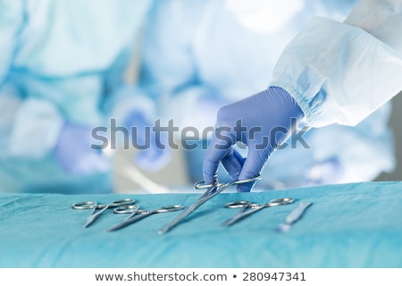 Stock photo: Surgeon With Scalpel Performing Operation In Operation Theater