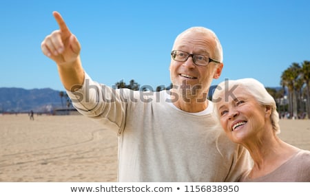 Foto stock: Happy Senior Couple Over Venice Beach Background