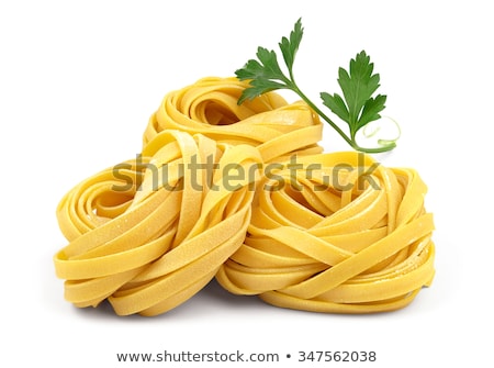 Сток-фото: Raw Tagliatelle Pasta Nests Isolated On White Background