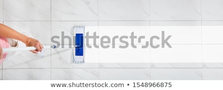 Foto stock: Janitor Cleaning Floor With Mop