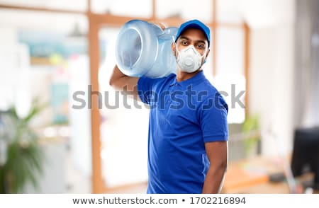 Stock fotó: Happy Indian Delivery Man With Water Barrel