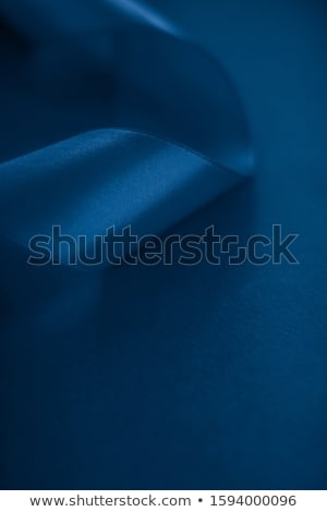 Stok fotoğraf: Abstract Silk Ribbon On Royal Blue Background Exclusive Luxury