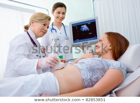 Stock fotó: Nurse Looking At Ultrasound