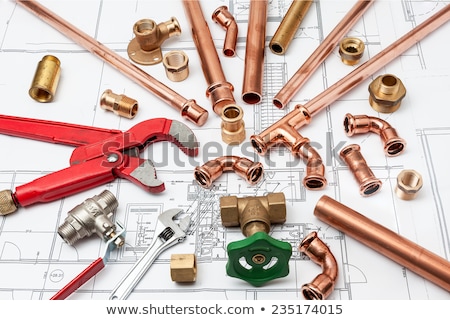 Stok fotoğraf: Plumbing Tools On The Construction Drawings