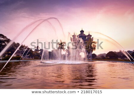 Foto stock: Patuxai Arch Or Victory Triumph Gate Monument With Fountain In Front Vientiane Laos