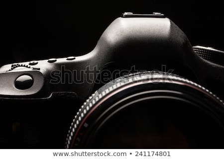 [[stock_photo]]: Professional Modern Dslr Camera Low Key Image